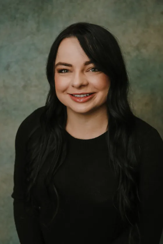 Professional portrait of Abi, smiling