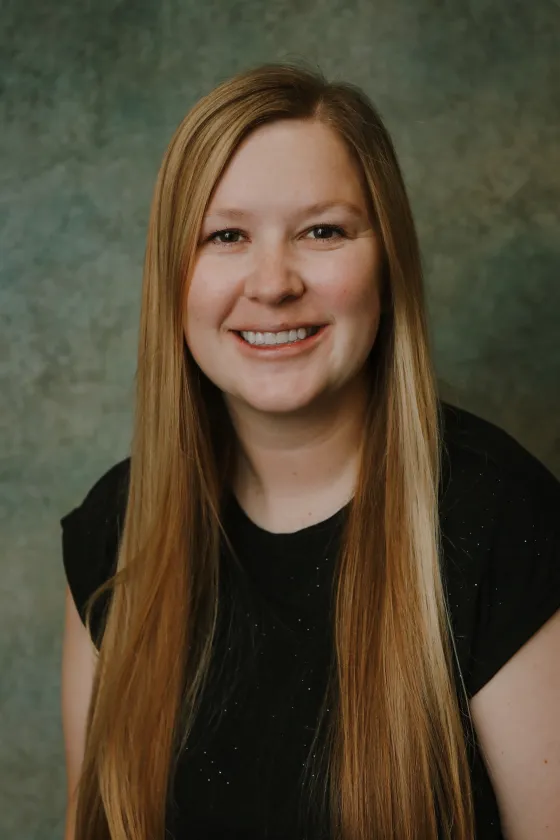 Professional portrait of Allie, smiling