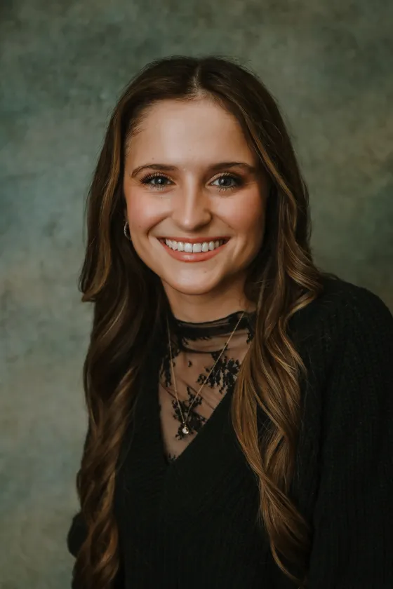 Professional portrait of Shae, smiling