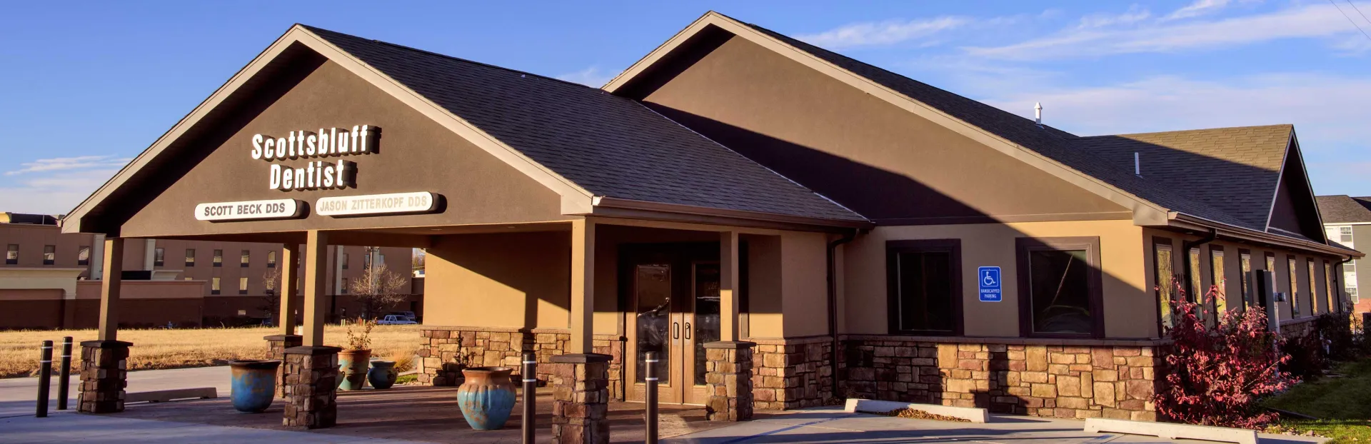 Exterior of the Scottsbluff Dentist office, with signage for Scott Beck DDS and Jason Zitterkopf DDS above the entrance.